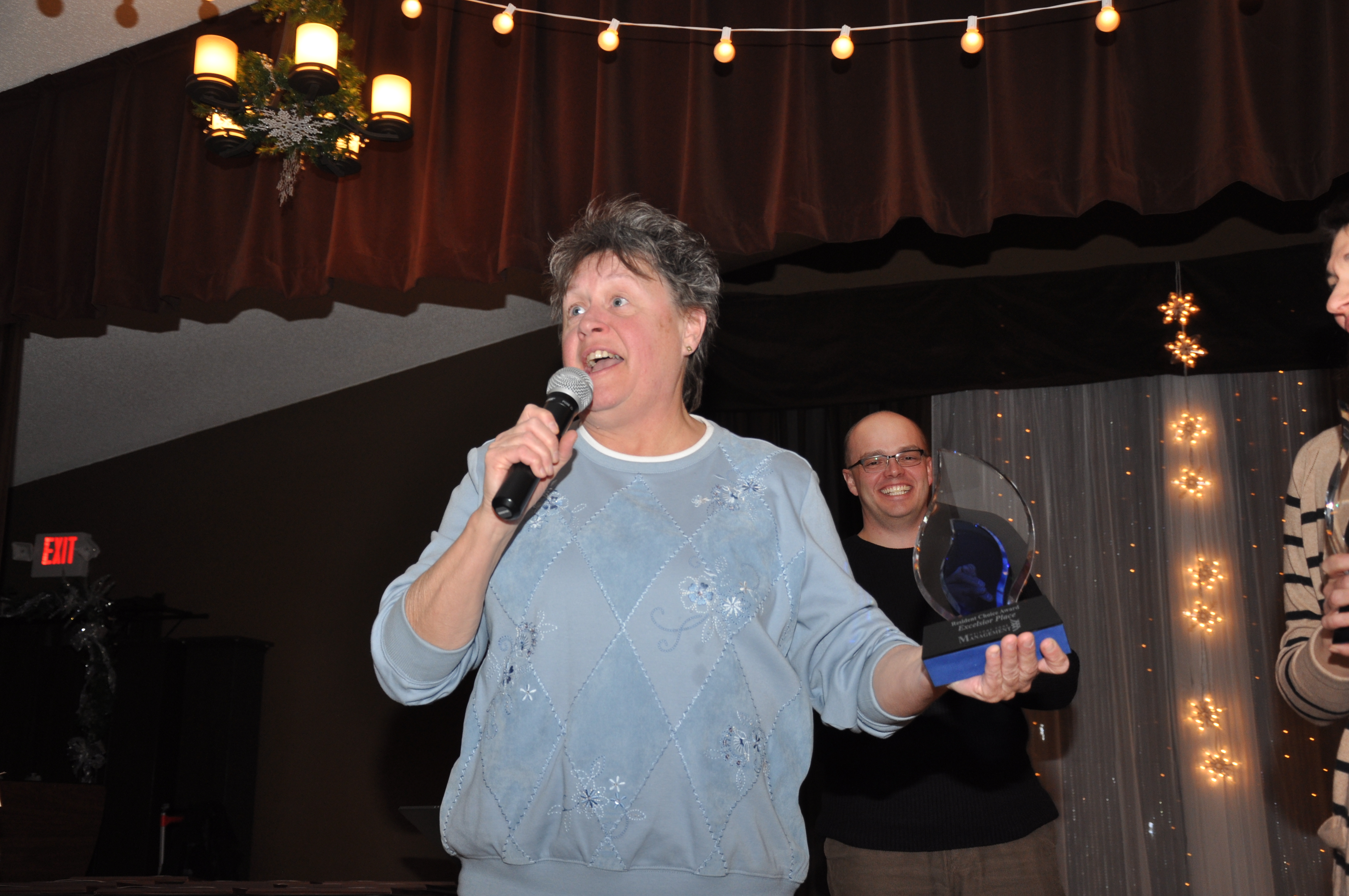 Loree Besser accepts the Resident Choice Award for Excelsior Place.